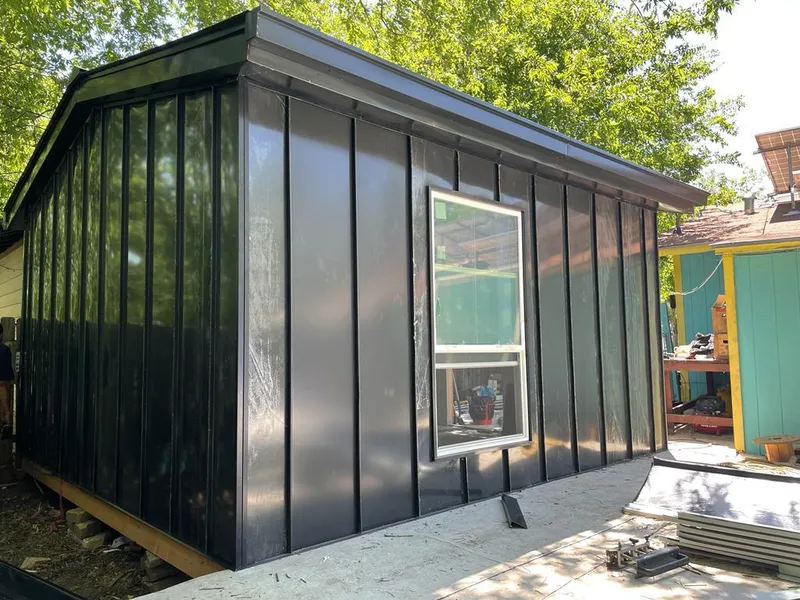 Black standing seam metal wall panels for Roof Inspection in Goleta