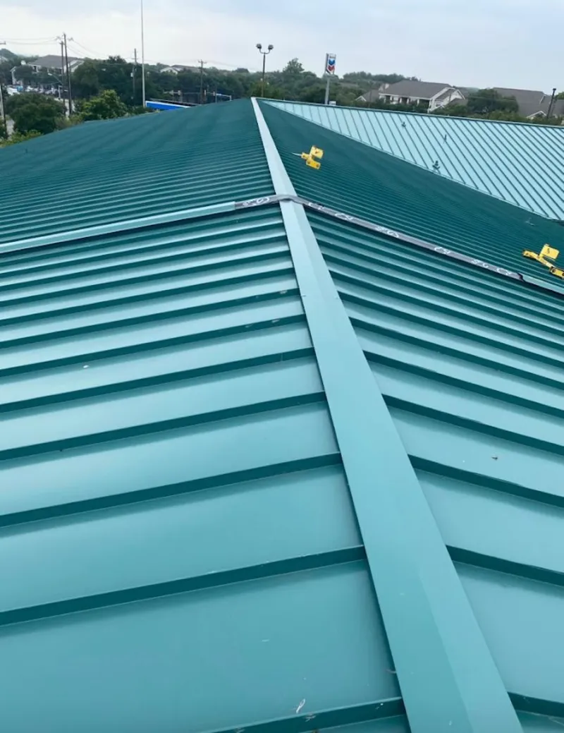 Green commercial metal roof ridge and valley for Metal Roof Repair in Goleta