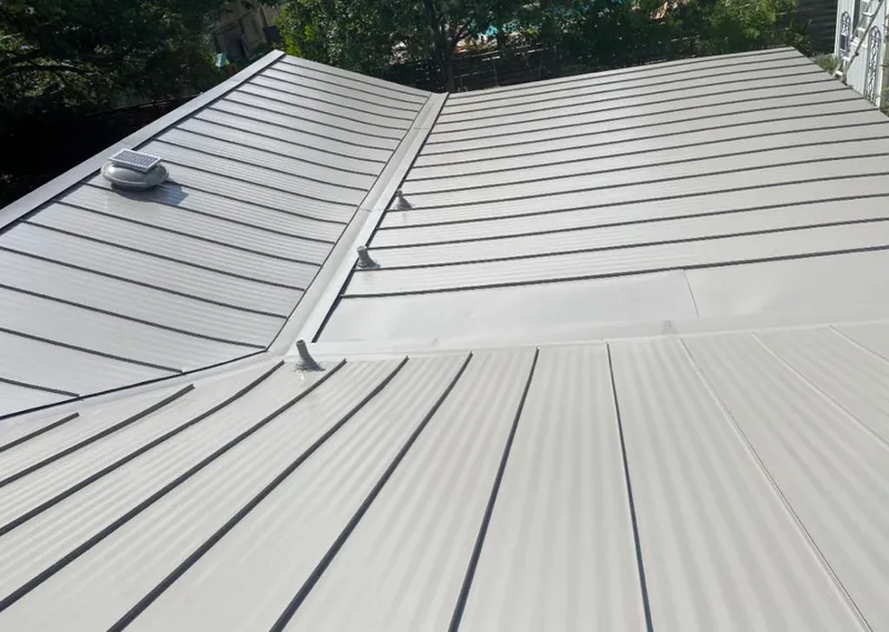 Solar attic fan installed on a metal roof for Roof Ventilation in Goleta